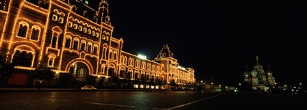 Facade of a building lit up at night, GUM, Red Square, Moscow, Russia by Panoramic Images art print
