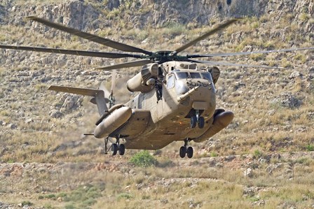 A CH-53 Yasur 2000 of the Israeli Air Force landing in the field by Ofer Zidon/Stocktrek Images art print