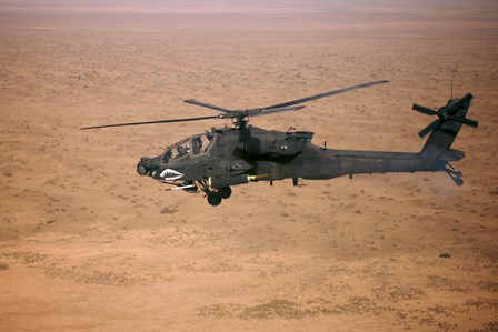 An AH-64D Apache Longbow Fires a Hydra Rocket over Northern Iraq by Terry Moore/Stocktrek Images art print
