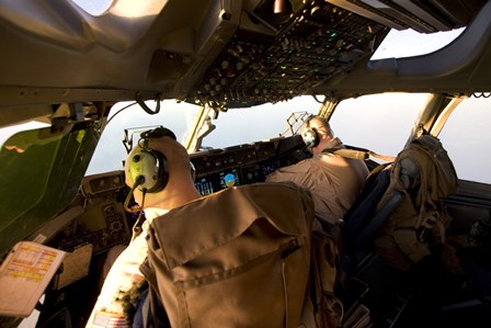 US Army Pilots in-Flight in the Cockpit of a C-17 Globemaster III during a Mission to Qatar by Terry Moore/Stocktrek Images art print