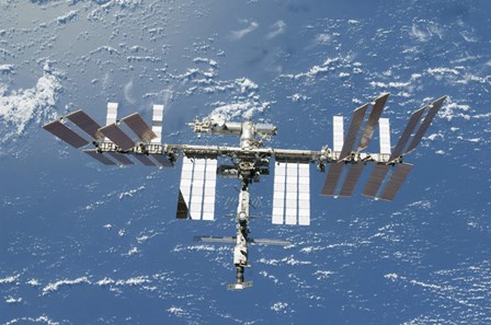 International Space Station Backdropped by a Blue and White Part of Earth by Stocktrek Images art print