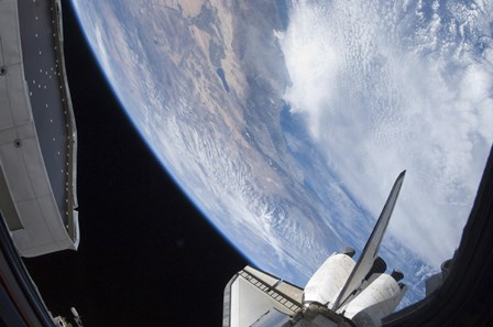 Part of Space shuttle Discovery Backdropped against the Pacific Coast of California by Stocktrek Images art print